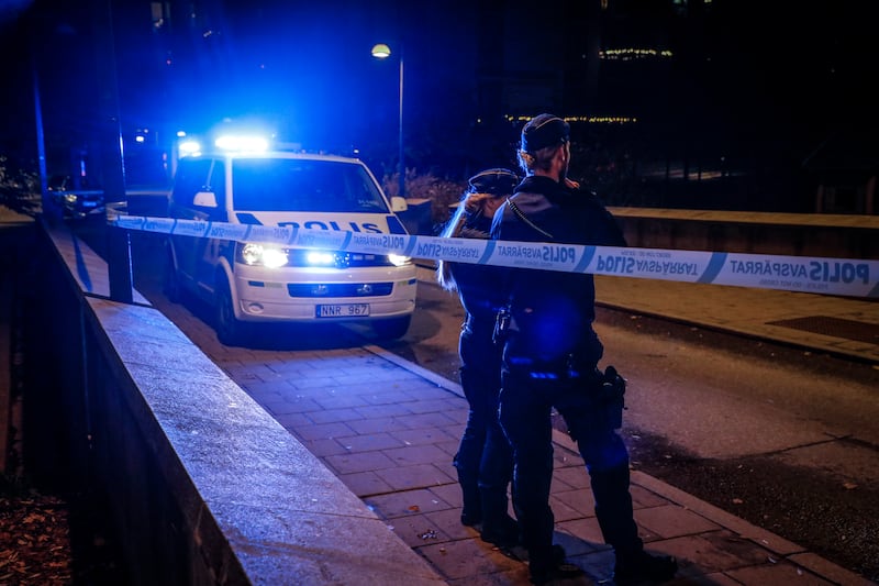Police guard the scene in Stockholm where Einar was shot several times outside an apartment building. Ambulance personnel administered first aid but he died at the scene. EPA