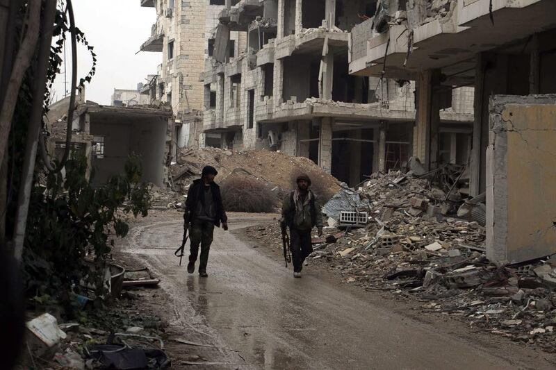Rebel fighters in Jobar, Syria. Amer Almohibany / AFP

