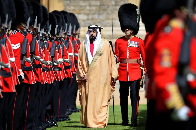 Emirati President Sheikh Khalifa bin Zayed al-Nahayan (C) inspects members of the 1st Battalion Welsh Guards during a ceremonial welcome in the grounds of Windsor castle, in Berkshire, west of London on April 30, 2013. President Sheikh Khalifa begins a State visit to the UK today, the first for a UEA President in 24 years. AFP PHOTO / BEN STANSALL
 *** Local Caption ***  019759-01-08.jpg