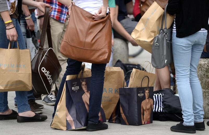 Shoppers rest with their purchases in downtown Hanover. Fabian Bimmer / Reuters