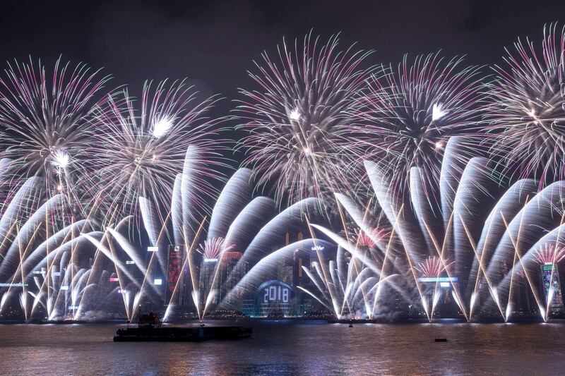 Fireworks explode over Victoria harbour during New Year celebrations in Hong Kong. Dale De La Rey / AFP