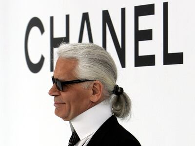 FILE PHOTO -  German designer Karl Lagerfeld appears on the catwalk after his Autumn/Winter 2004/2005 high fashion collection for the Chanel fashion house in Paris, July 7, 2004. CPROD REUTERS/Philippe Wojazer/File Photo