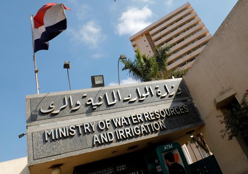 A man walks in front of the Ministry of Water Resources and Irrigation headquarters in Cairo during a meeting between Egypt, Ethiopia and Sudan over disputed Nile dam, Egypt December 3, 2019. REUTERS/Amr Abdallah Dalsh