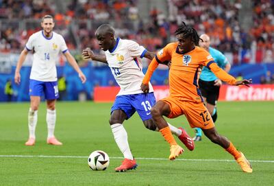 France's Ngolo Kante and Jeremie Frimpong battle for the ball. PA