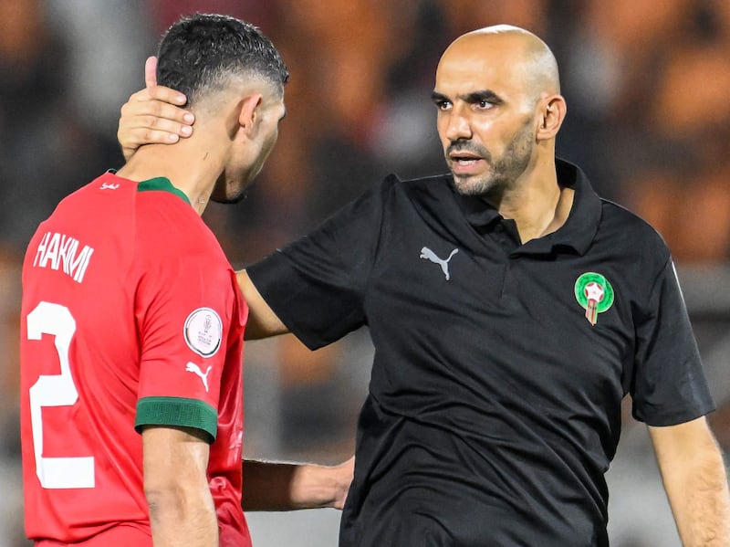 Morocco manager Walid Regragui consoles Achraf Hakimi after their Africa Cup of Nations defeat against South Africa at the Stade Laurent Pokou, in San Pedro, on January 30, 2024. AFP