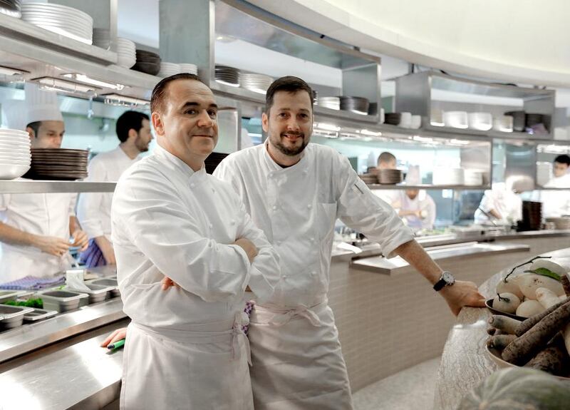 Jean-Georges Vongerichten, left, at his restaurant in the Four Seasons Resort Dubai at Jumeirah Beach with executive chef Colin Clague. Victor Besa for The National