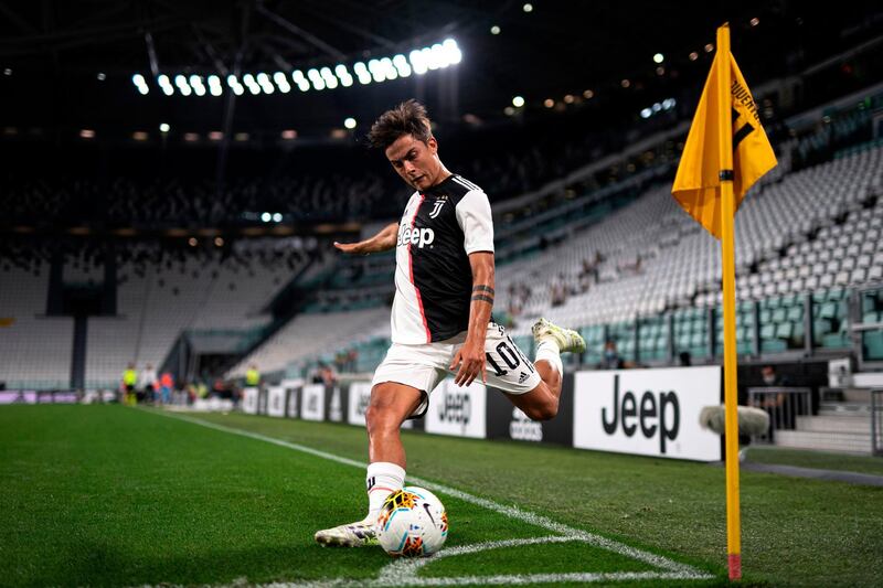 Juventus' Argentine forward Paulo Dybala takes a corner during the Italian Serie A football match between Juventus and Lazio, at the Allianz stadium, in Turin, Italy. AFP