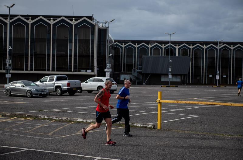 Guests exercise in the car park of the Radisson Blu hotel.