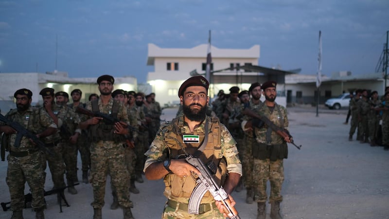 epa07907085 Turkey-backed members of Syrian National Army prepare for moving to Turkey for an expected military operation by Turkey into Kurdish areas of northern Syria, in Azas near Turkey border, Syria, 08 October 2019 (issued 09 October 2019).  US President Donald J. Trump announced the withdrawal of US troops from the area ahead of the anticipated action by Turkish President Recep Tayyip Erdogan.  EPA/STR