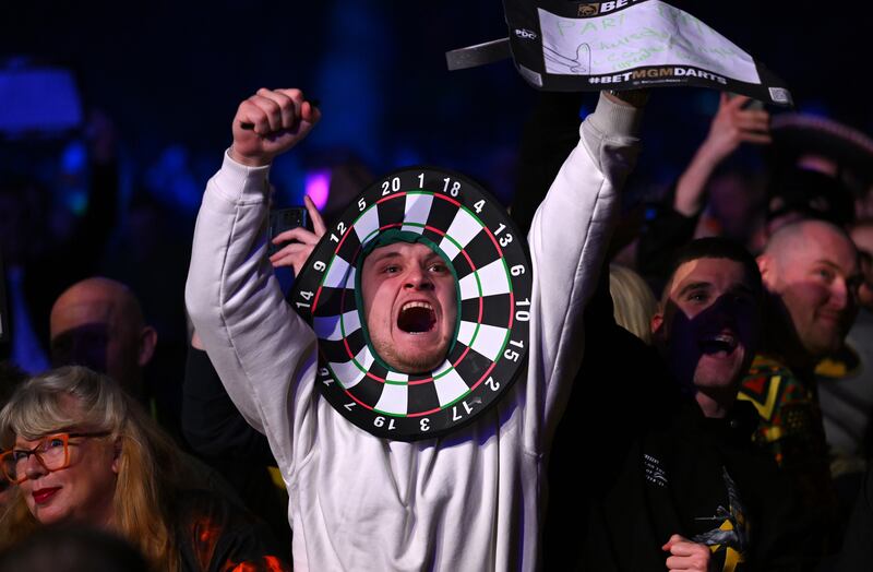 Darts fans enjoy the atmosphere during the 2024 BetMGM Premier League Darts at Utilita Arena in Newcastle upon Tyne, England. Getty Images