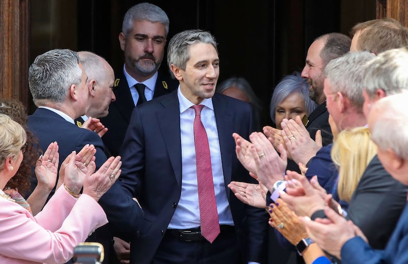 Fine Gael leader and Ireland's new Prime Minster Simon Harris is greeted by colleagues and family members as he leaves the Dail, the lower house of the Irish Parliament, in Dublin on April 9. AFP