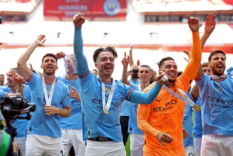 Manchester City players celebrate after winning the FA Cup final against Manchester United. Reuters