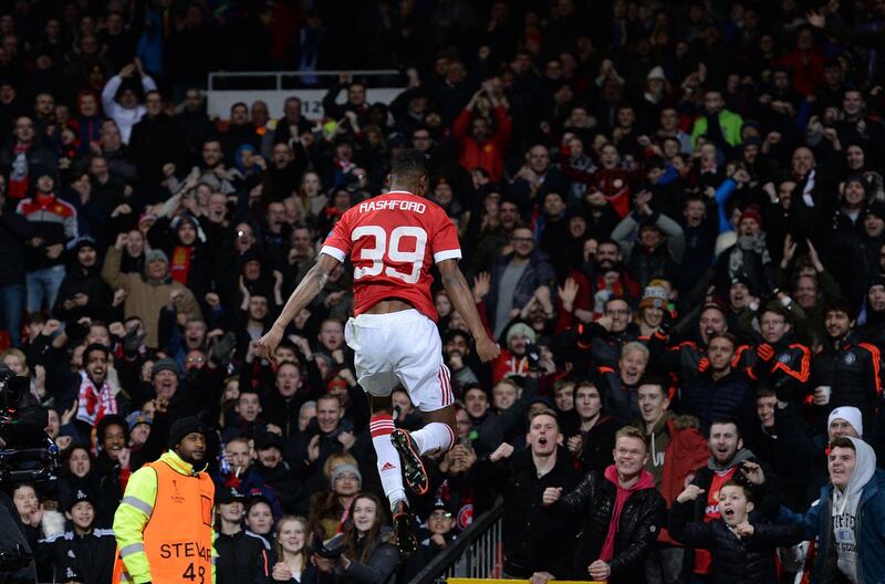 Manchester United's English striker Marcus Rashford celebrates scoring his team's second goal during the UEFA Europa League round of 32, second leg football match between Manchester United and and FC Midtjylland at Old Trafford in Manchester, north west England, on February 25, 2016. (Photo by OLI SCARFF / AFP)