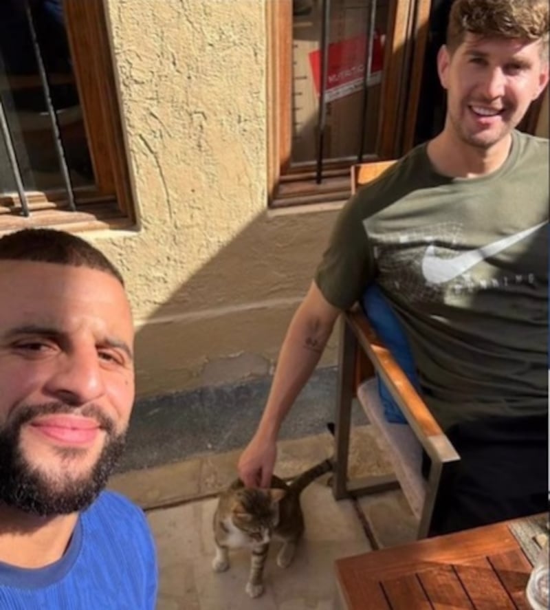 England stars Kyle Walker, left, and John Stones with their new dining partner, Dave. Photo: England Instagram account