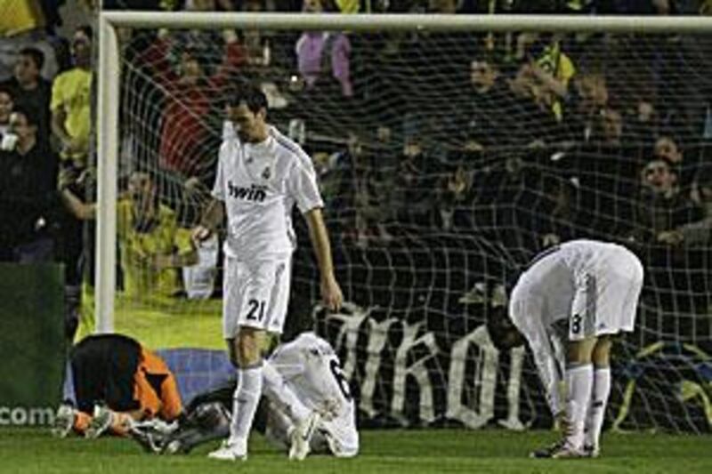 Real's players look distraught after conceding to Alcorcon at the Santo Domingo stadium in Madrid.