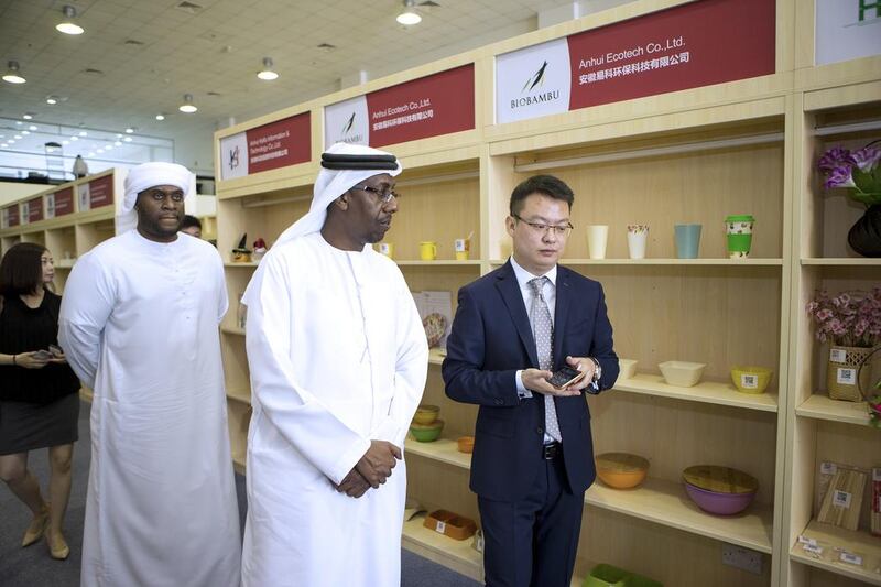 Frank Ji, the managing director of Oconnect, shows visitors around the company's showroom. Christopher Pike / The National