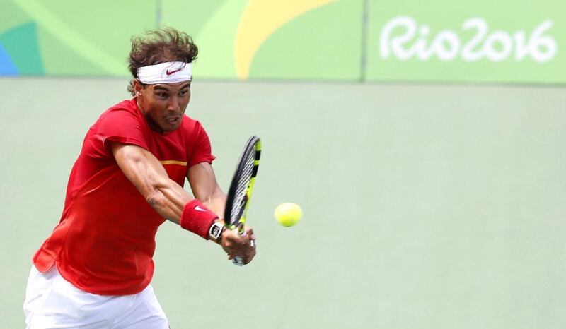 Rafael Nadal of Spain in action against Gilles Simon of France during their men’s singles third round match of the Rio 2016 Olympic Games tennis tournament in Rio de Janeiro, Brazil, 11 August 2016. Michael Reynolds / EPA