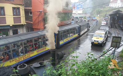 A steam engine side by side with more modern transport in Darjeeling. Taniya Dutta / The National