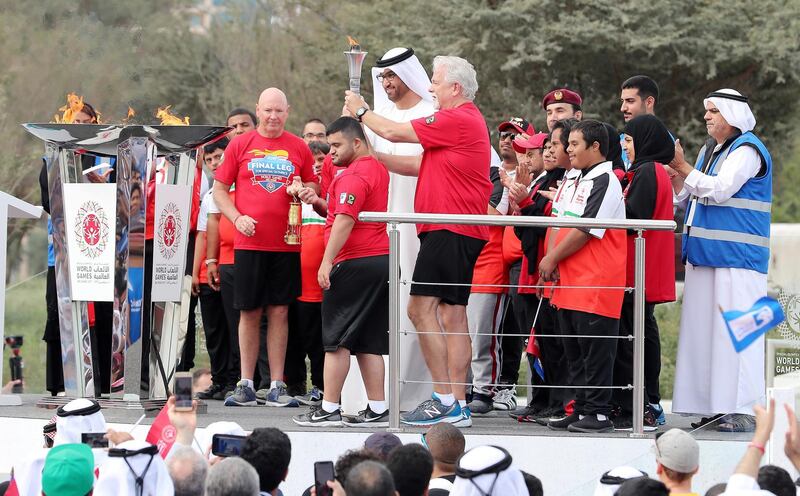 ABU DHABI , UNITED ARAB EMIRATES , March 3 – 2019 :- Dr. Sultan Ahmed Al Jaber, Minister of State, CEO of ADNOC Group taking the flame from the ADNOC’s “Flame of Hope” at the Founder’s memorial in Abu Dhabi. This Flame now go to Fujairah. ( Pawan Singh / The National ) For News/Online/Instagram/Big Picture. Story by John