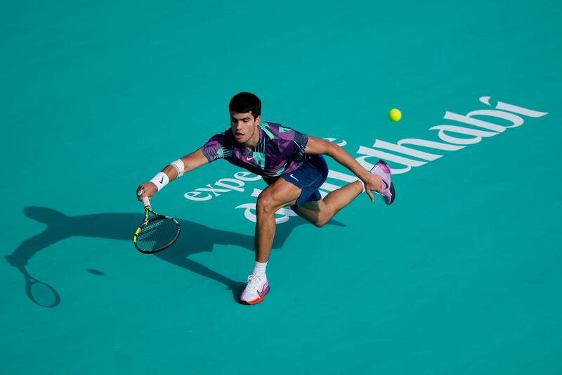 Carlos Alcaraz returns the ball to Casper Ruud. AP