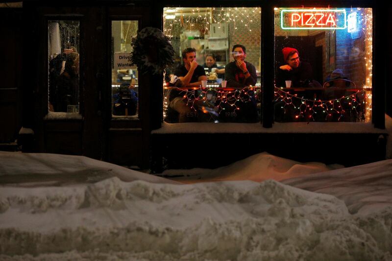 Diners sit in the front window of Nicoles South End pizzeria in Boston, Massachusetts. Brian Snyder / Reuters