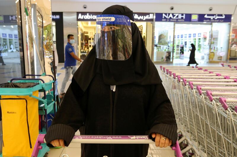 A Saudi woman, wearing a face shield, shops at a supermarket in Riyadh, Saudi Arabia. Reuters