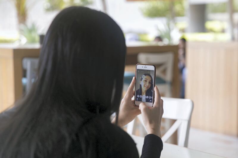 ABU DHABI, UNITED ARAB EMIRATES - AUGUST 14, 2018. 

A woman takes a selfie using Snapchat's face filter.

(Photo by Reem Mohammed/The National)

Reporter: 
Section:  NA