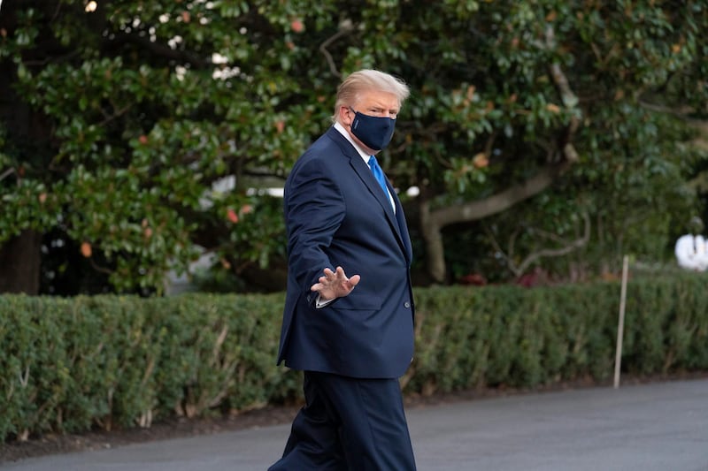 President Donald Trump waves as he leaves the White House to go to Walter Reed National Military Medical Center after he tested positive for COVID-19, Friday, Oct. 2, 2020, in Washington. (AP Photo/Alex Brandon)