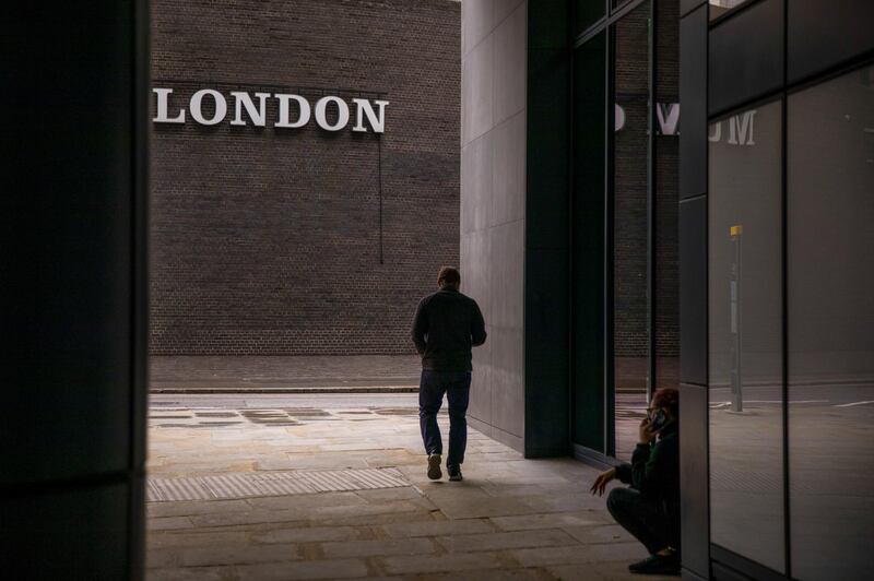 A pedestrian walks past a sign for the Museum of London in the City of London, U.K., on Monday, Oct. 12, 2020. The approach of Brexit has London confronting the loss of its role as Europe's undisputed stock-trading hub and, with it, billions of euros in daily trading. Photographer: Jason Alden/Bloomberg
