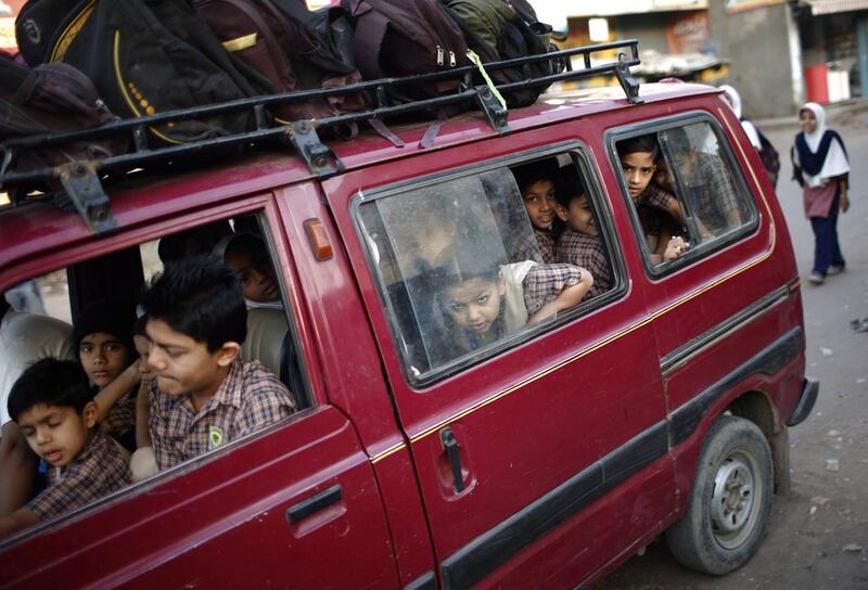 Children go to school in a van.