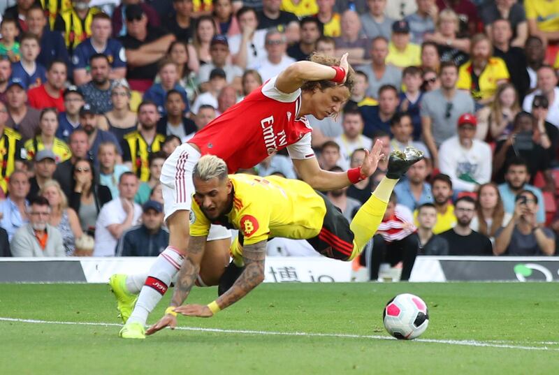 WATFORD, ENGLAND - SEPTEMBER 15:  Roberto Pereyra of Watford is fouled by David Luiz of Arsenal for a penalty during the Premier League match between Watford FC and Arsenal FC at Vicarage Road on September 15, 2019 in Watford, United Kingdom. (Photo by Marc Atkins/Getty Images)