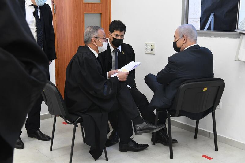 Israeli Prime Minister Benjamin Netanyahu (R) speaks with his lawyers prior to a hearing for his trial over alleged corruption crimes, at the Jerusalem district court, in Salah El-Din, East Jerusalem. Netanyahu returned to court to formally respond to charges of bribery, fraud and breach of trust, just weeks ahead of the national elections.  EPA