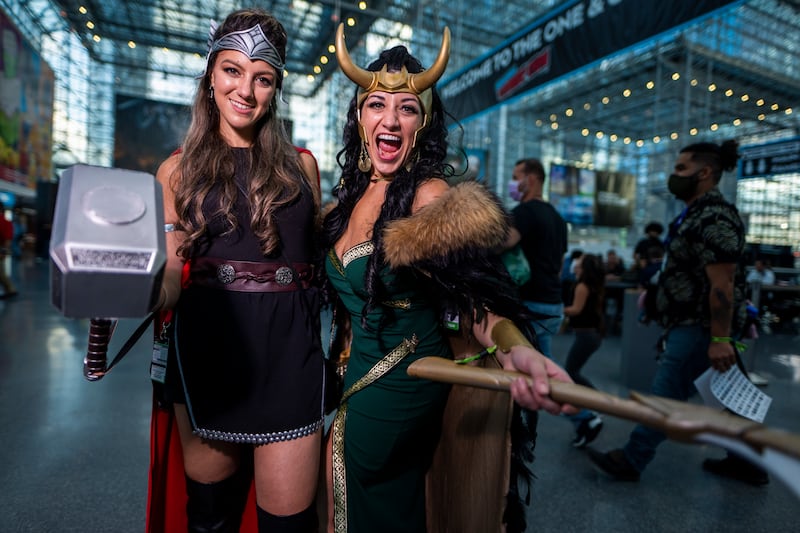 Cosplayers as Thor, left, and Loki pose during New York Comic Con. Charles Sykes / Invision / AP