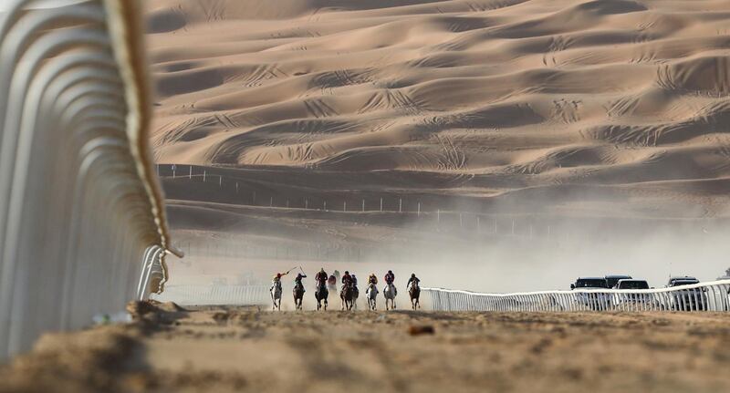 Jockeys compete in a race for purebred Arab horses during the Liwa 2019 Moreeb Dune Festival in the Liwa desert. AFP