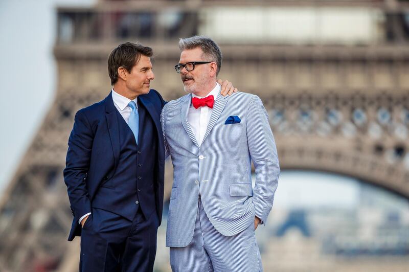 epa06884480 US actor/cast member Tom Cruise (L) poses with US director Christopher McQuarrie in front of the Eiffel Tower as they arrive for the global premiere of 'Mission: Impossible - Fallout' in Paris, France, 12 July 2018. The movie will be released in French theaters on 01 August.  EPA-EFE/CHRISTOPHE PETIT TESSON