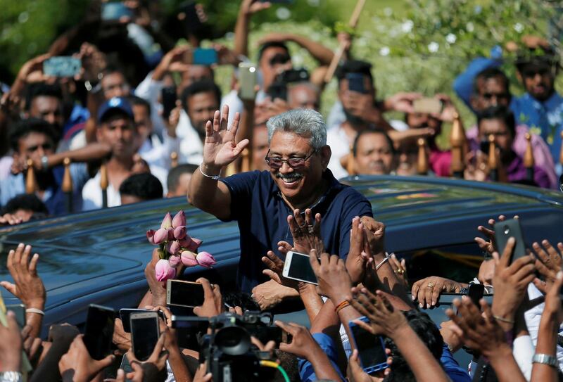 Sri Lanka's former defence secretary Gotabaya Rajapaksa greets his supporters after his return from the United States, in Katunayake, Sri Lanka. Reuters