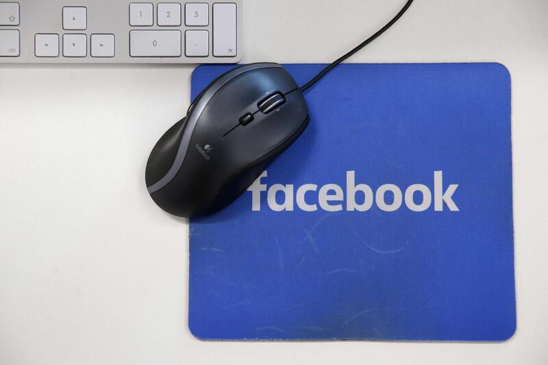 (FILES) This file photo taken on December 4, 2017 shows a mousepad with the Facebook logo  at Facebook's  headquarters,in London.
Shares of Facebook tumbled on january 12, 2018 after it announced an overhaul of its newsfeed, while US stocks added to records following data showing higher retail sales in December. About 12 minutes into trading, the Dow Jones Industrial Average was at 25,675.70, up 0.4 percent.
 / AFP PHOTO / Daniel LEAL-OLIVAS