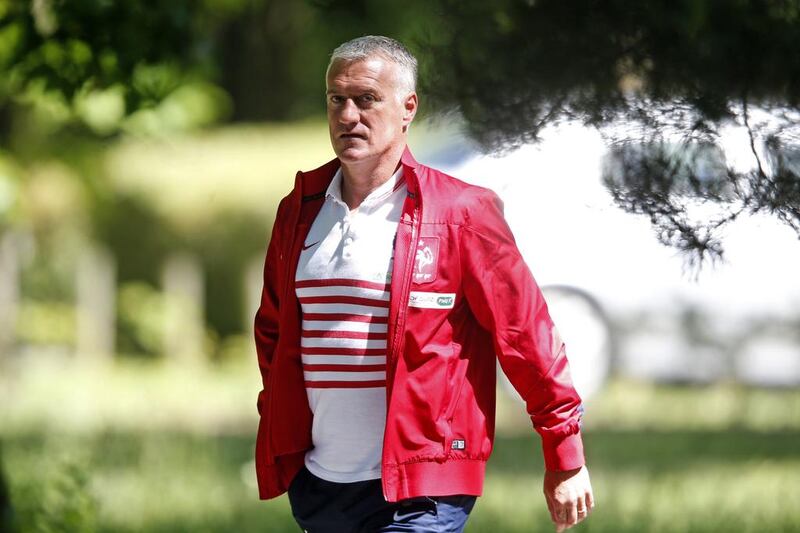 France coach Didier Deschamps walks to attend a news conference at the team training centre of Clairefontaine on June 6, 2014. Charles Platiau / Reuters
