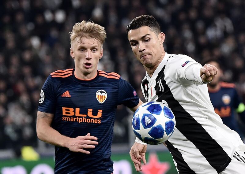 Juventus forward Cristiano Ronaldo, right, prepares to shoot past Valencia's Daniel Wass. AFP