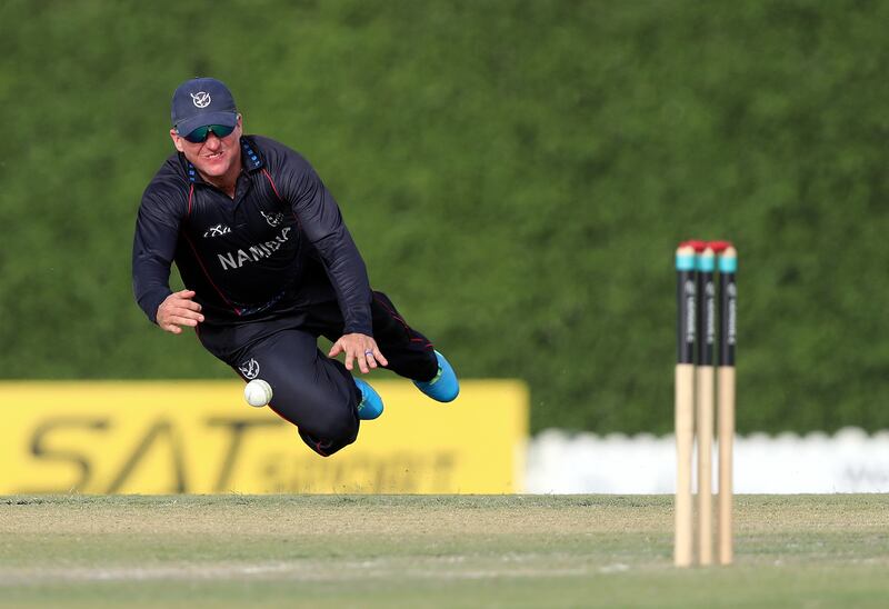 Namibia's Stephen Williams attempts a run out. 