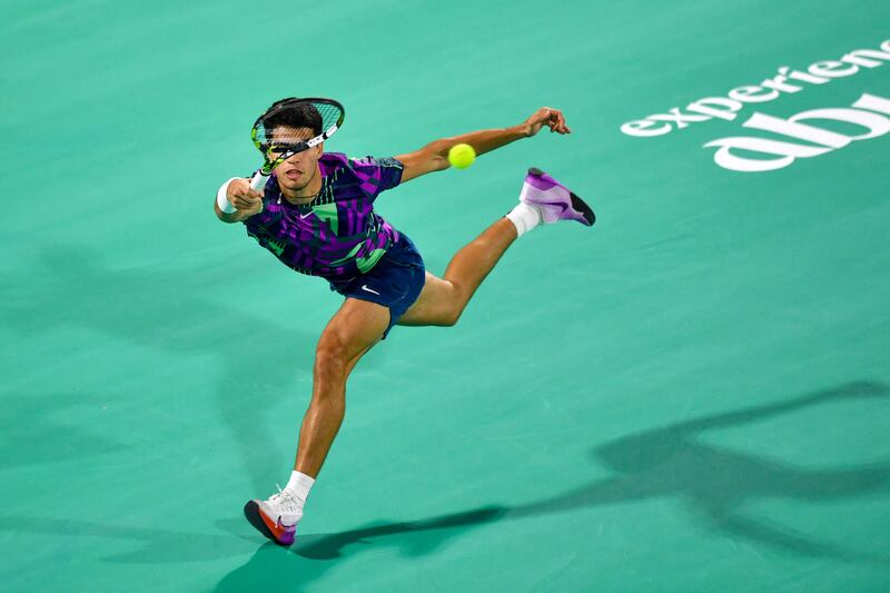 Carlos Alcaraz returns the ball to Andrey Rublev. AFP