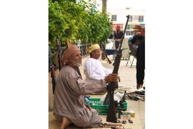 There is a market in the city of Salalah selling rifles and knives.