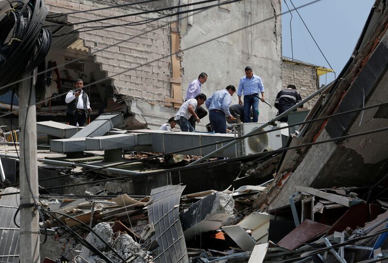 People work at a collapsed building after an earthquake in Mexico City. Claudia Daut / Reuters