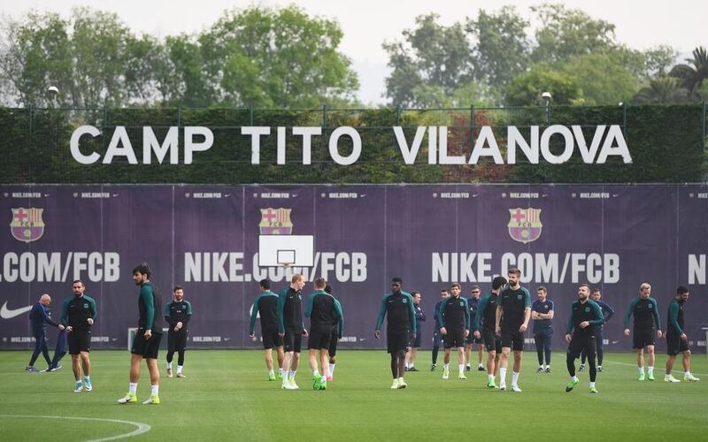 Barcelona players warm up during at FC Barcelona Sports Centre in Barcelona, Spain. David Ramos / Getty Images