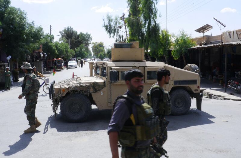 In this photograph taken on May 19, 2018, Afghan security forces patrol, after recapturing control of the city from Taliban militants, in Farah. Afghan commandos and US air strikes have driven the Taliban to the outskirts of Farah city, officials said May 16, after a day-long battle to prevent the insurgents from seizing the western provincial capital. / AFP / HAMEED KHAN
