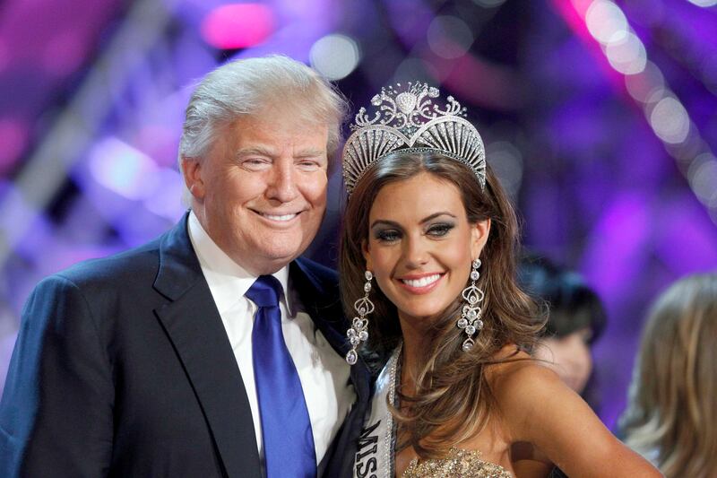 Donald Trump, co-owner of the Miss Universe Organization, poses with Miss Connecticut Erin Brady at a news conference after she was crowned Miss USA 2013 at the Planet Hollywood Resort and Casino in Las Vegas, Nevada June 16, 2013. REUTERS/Steve Marcus (UNITED STATES - Tags: ENTERTAINMENT BUSINESS) FOR EDITORIAL USE ONLY. NOT FOR SALE FOR MARKETING OR ADVERTISING CAMPAIGNS *** Local Caption ***  LAV09_USA-_0617_11.JPG
