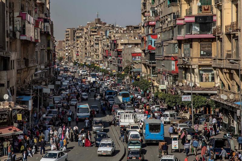 People crowd a street a few hours ahead of curfew in Cairo, Egypt on April 14. AP Photo