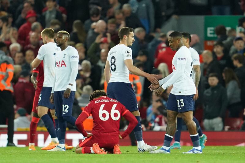 Tottenham players and Liverpool's Trent Alexander-Arnold at the end of the match. AP