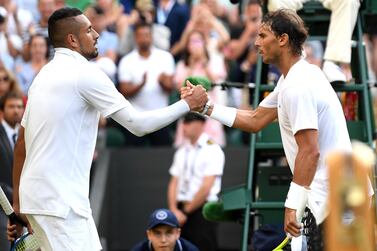 Rafael Nadal shakes hands at the net with Nick Kyrgios after winning their second-round Wimbledon clash. Getty Images