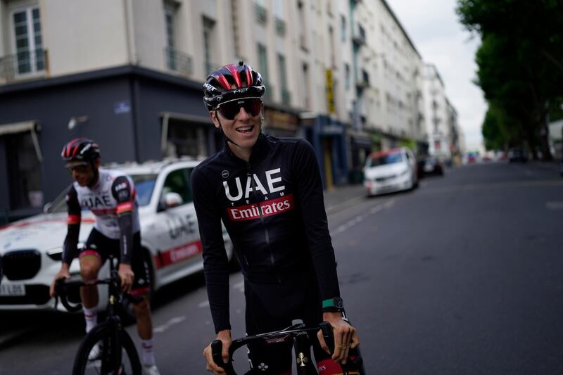 Slovenia's Tadej Pogacar smiles during a training ride, in Brest, western France. AP